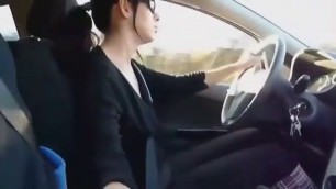 Girl driving a cock while driving in a car